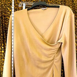 Shimmering gold knit top with ruching on sides